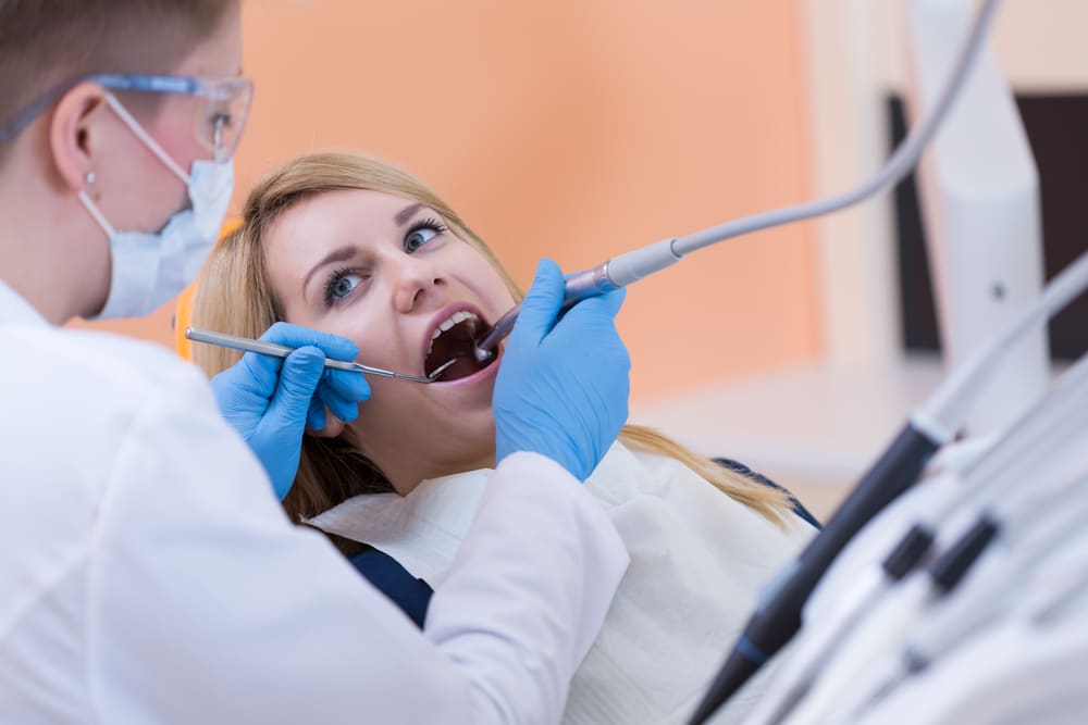 A dentist and a patient during a root canal treatment