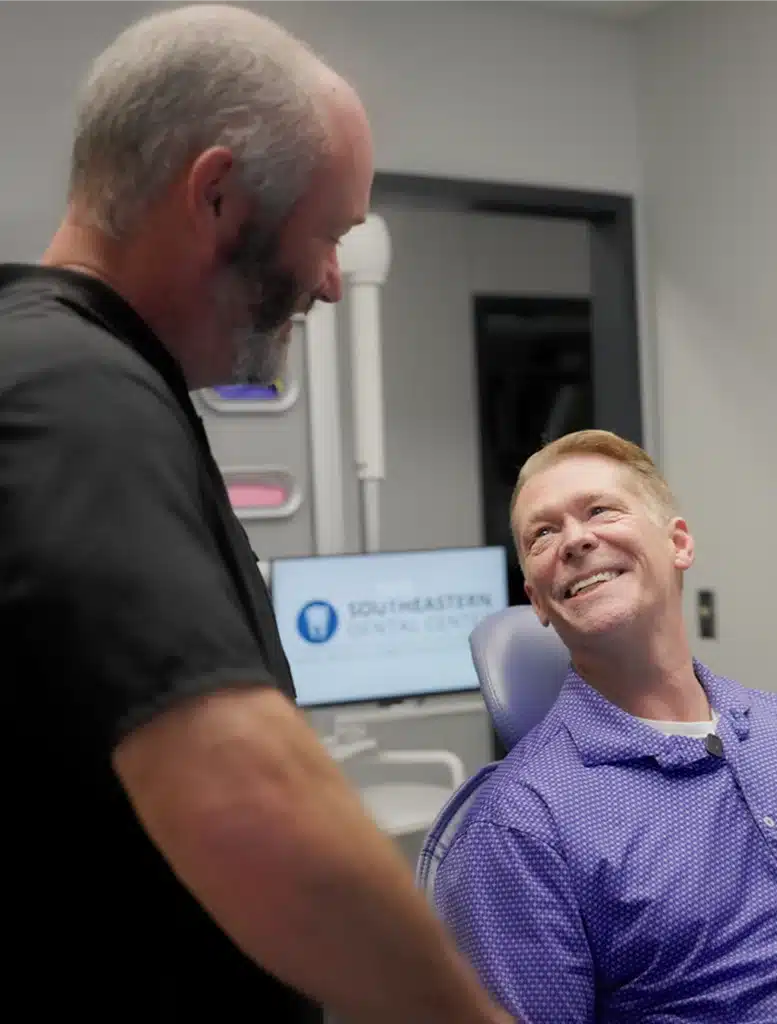 Woman in dental chair being examined by a dentist in Columbus GA